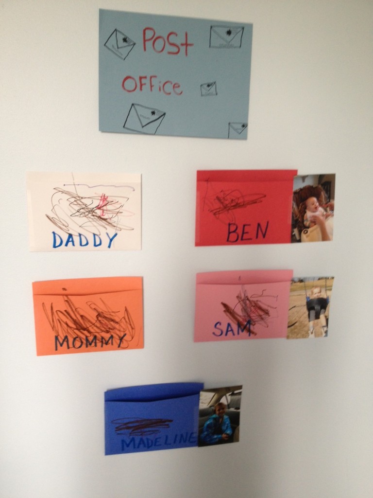 A picture of our preschool post office on my preschoolers bedroom wall. We have an envelope 'mailbox' for Mommy, Daddy, and both siblings too. 