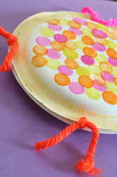 a tambourine made from two paper plates