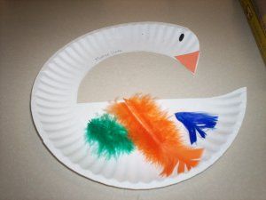 a paper plate craft with a paper plate cut to look like a swan