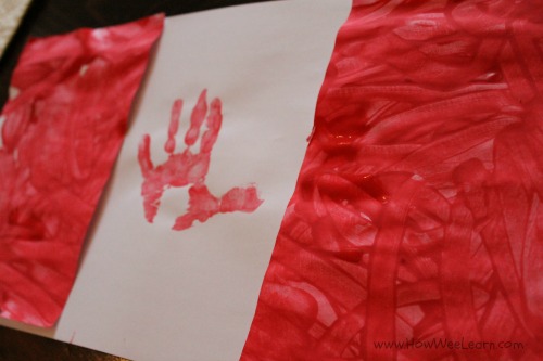 A handprint Canada flag craft perfect for Canada Day this summer!
