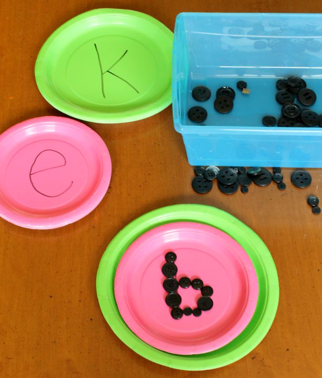 Learn letters with a "watermelon seed" quiet bin activity