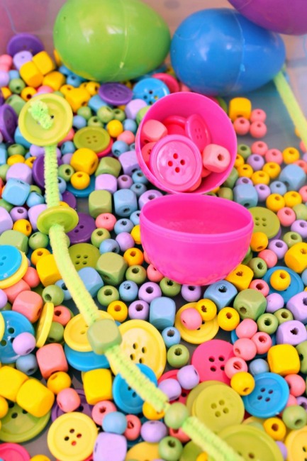 Preschool Easter activities - colorful fine motor bin with eggs