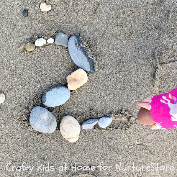 number summer learning - rock numbers on the beach