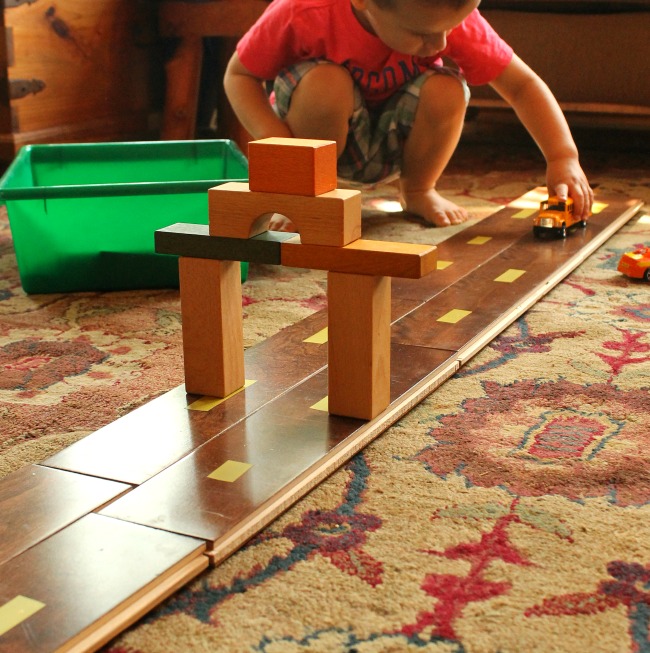 Using laminate flooring as a road! Brilliant DIY toy for preschoolers