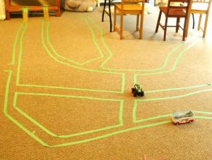 Use painters tape to make roads, maps, and mazes on the ground for preschoolers! Perfect quiet time activities.