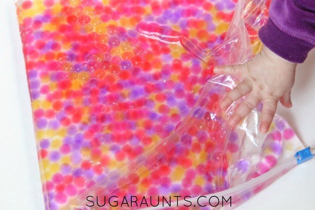 Sensory Activity for Toddlers - place colourful water beads in a sensory bag with water