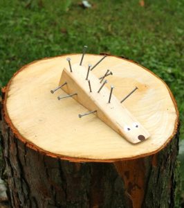 Adorable woodworking craft for kids! Use a hammer and nails to make this cute wooden porcupine. Such a fun craft for preschoolers and big kids too. #craft #hammer #woodworking #kids #preschool #hedgehog #porcupine