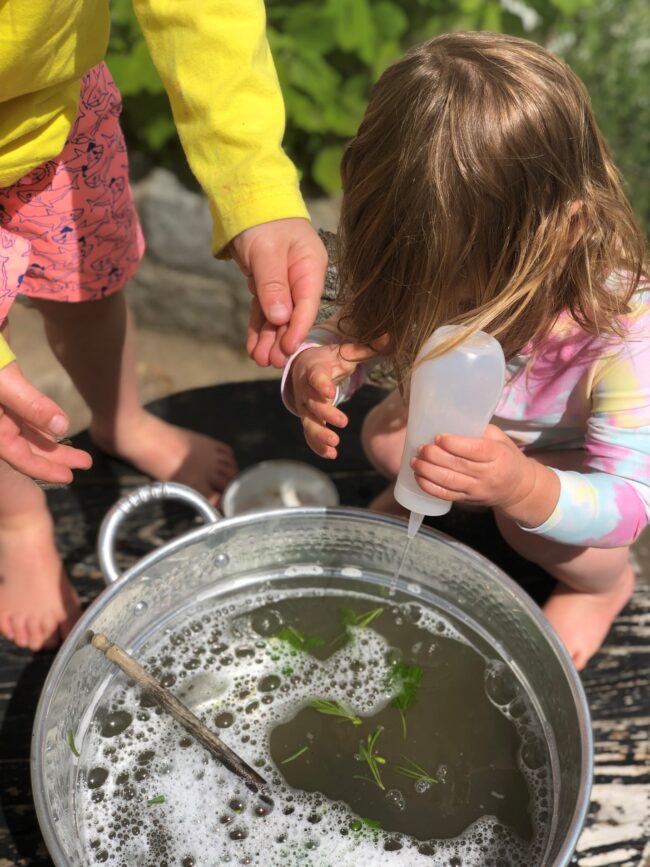 Outdoor pretend play - so much fun! Mixing Up Some Nature Soup is an amazing outdoor activity for the kids