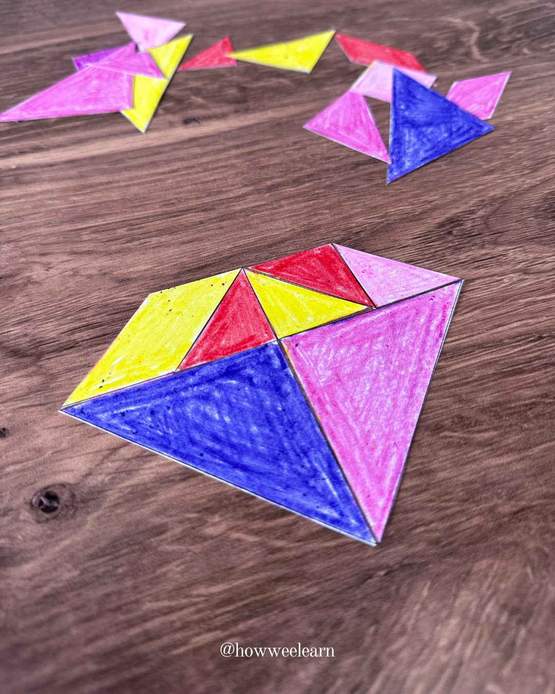 DIY tangram pieces in the shape of a diamond coloured with crayon