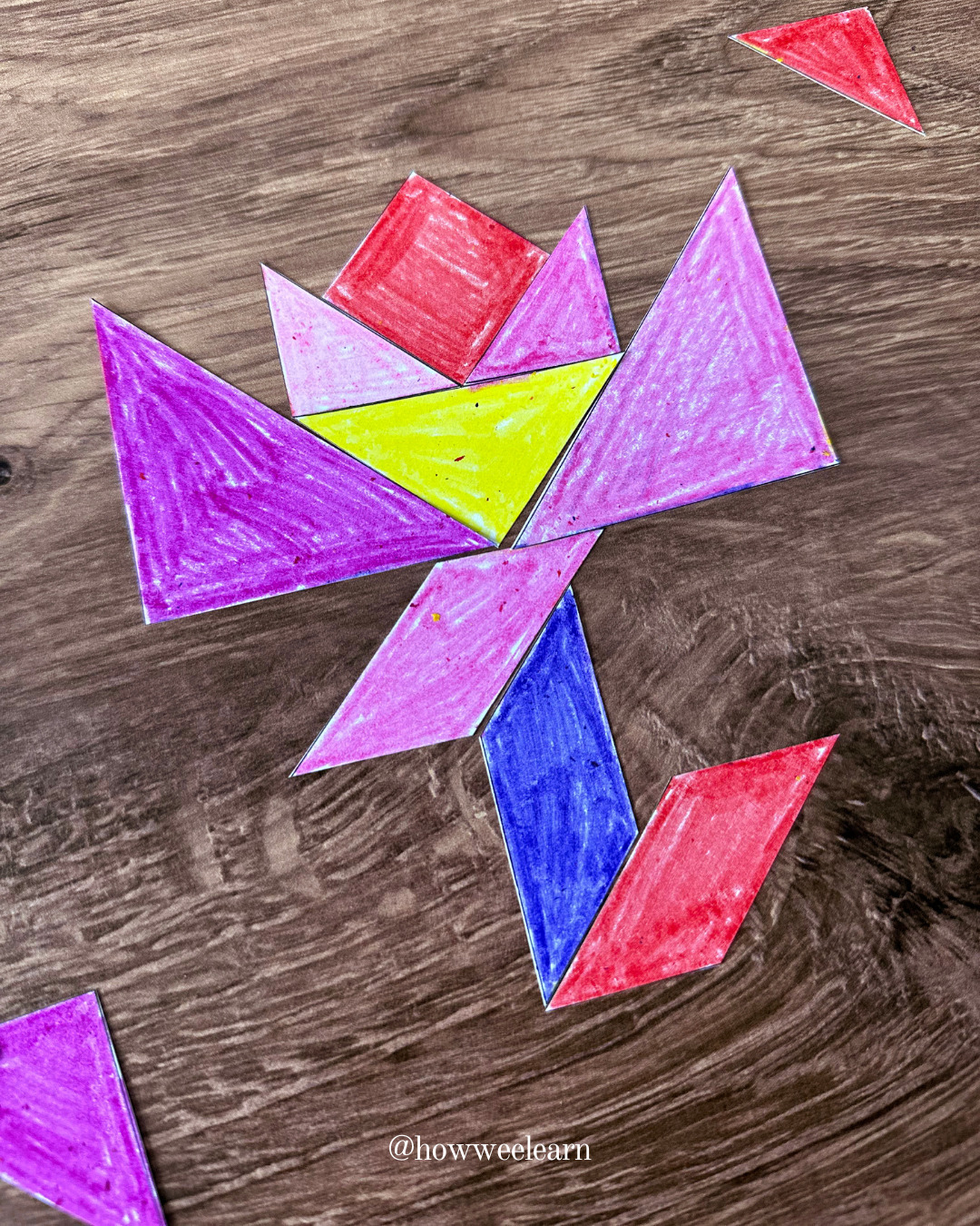 printable tangram puzzles in the shape of a flower coloured with crayon