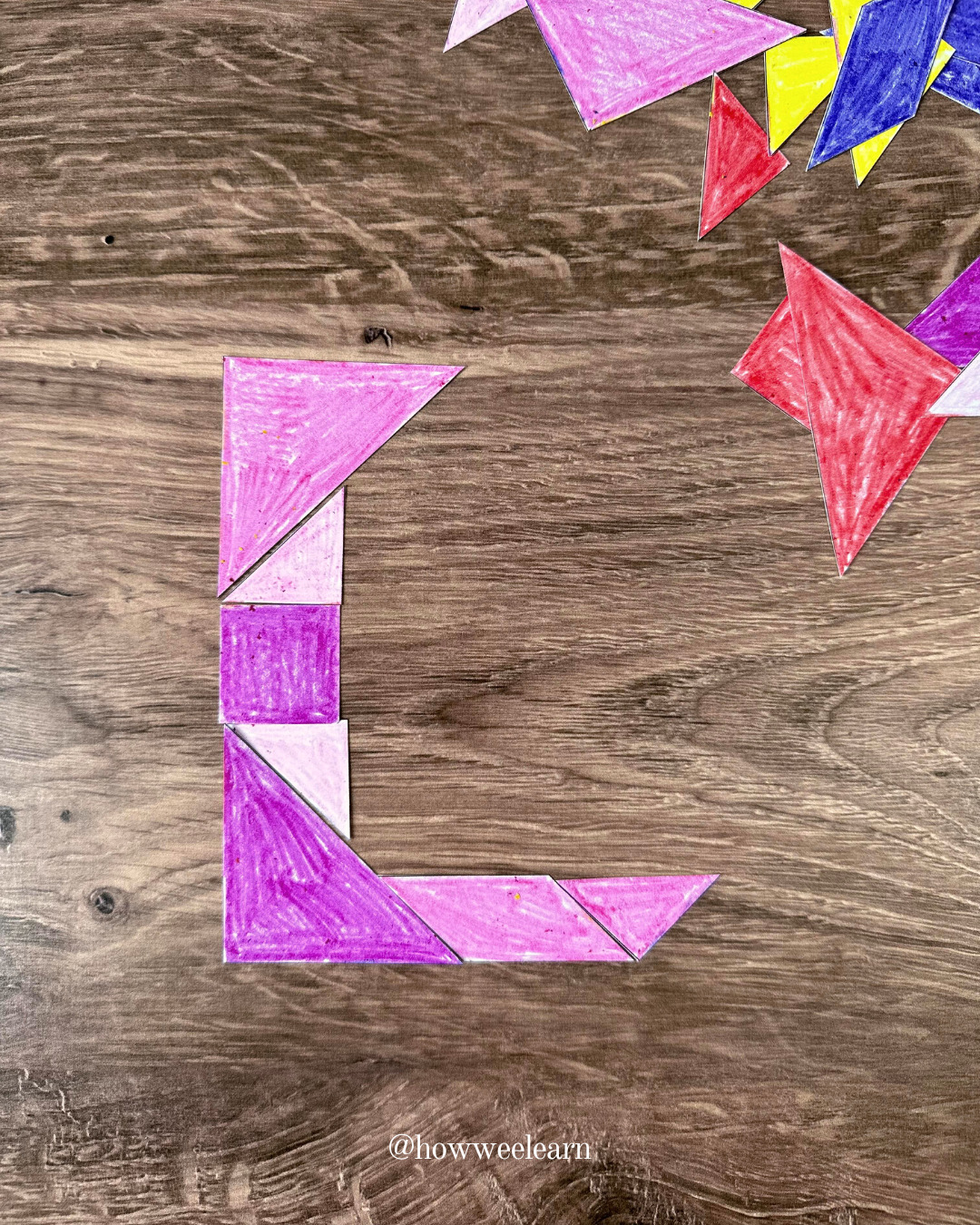 DIY tangram pieces in the shape of an L coloured with crayon
