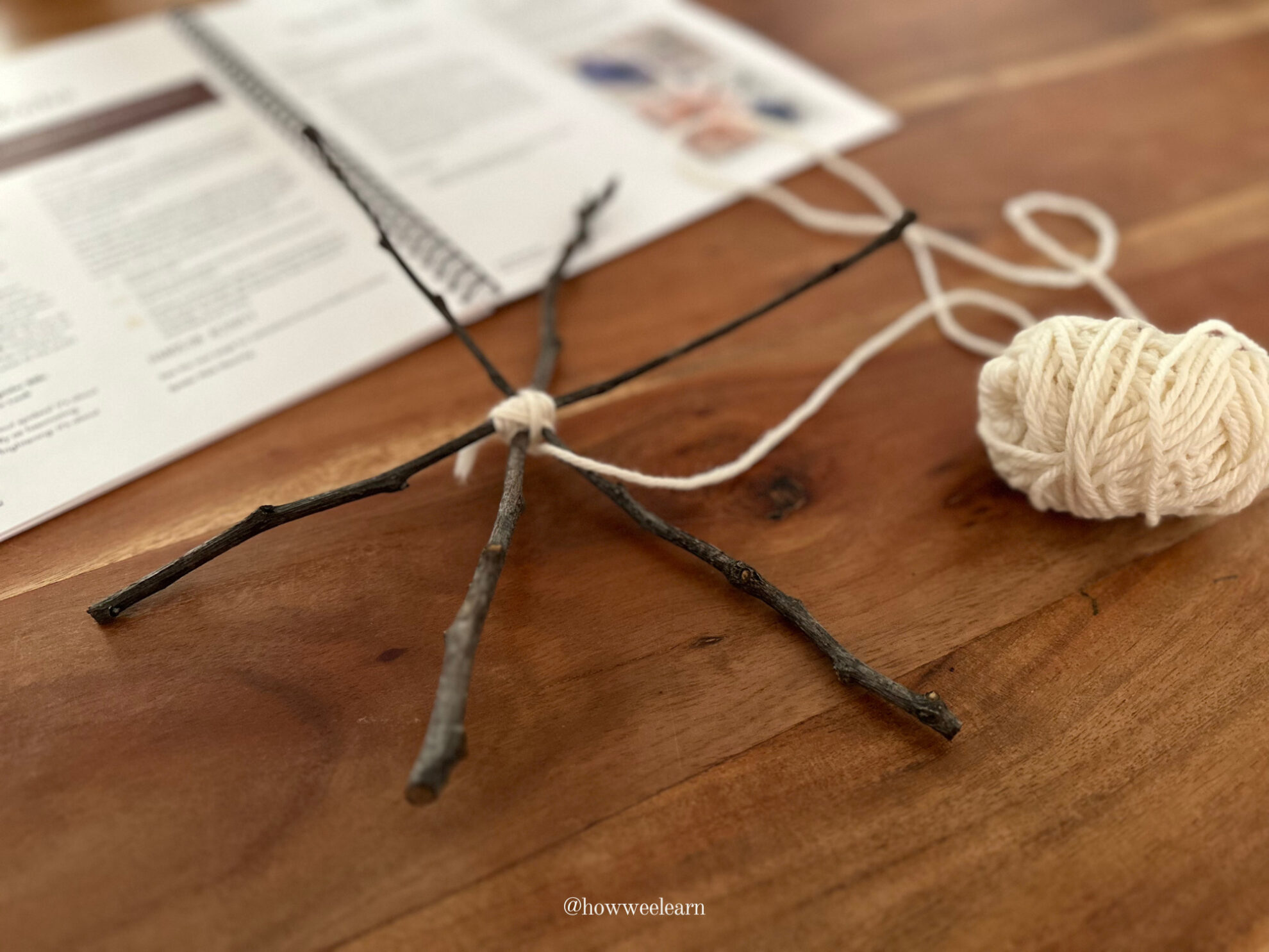 Spider Web Weaving: Secure three sticks in the middle with yarn