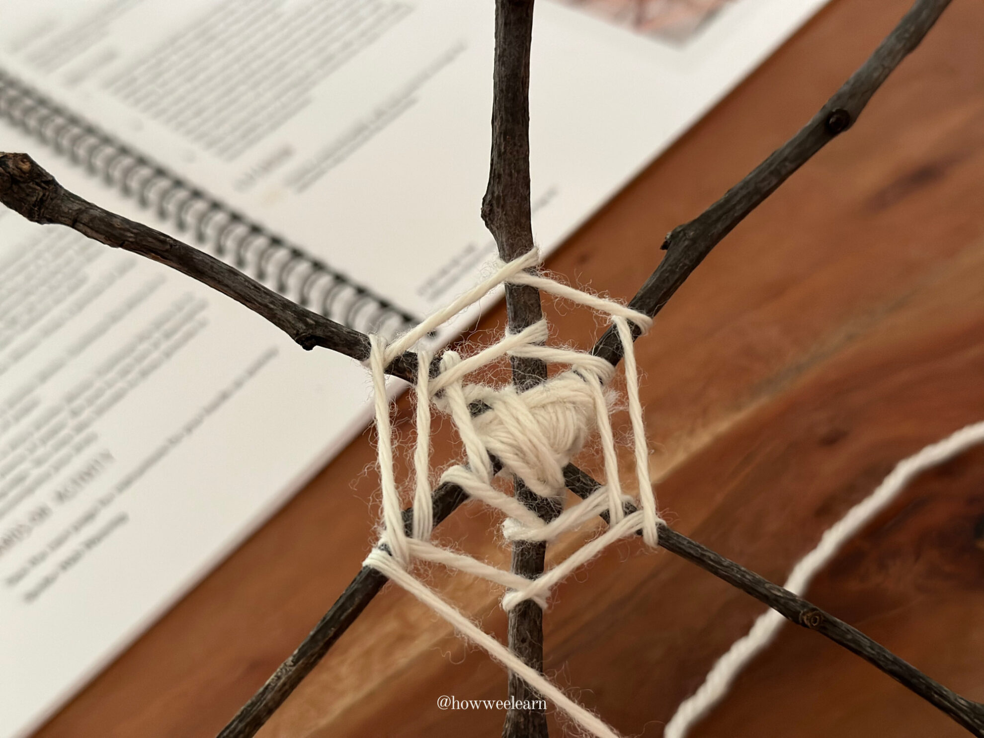 Spider Web Weaving: Wrap the yarn around each stick, moving around each stick in a circle