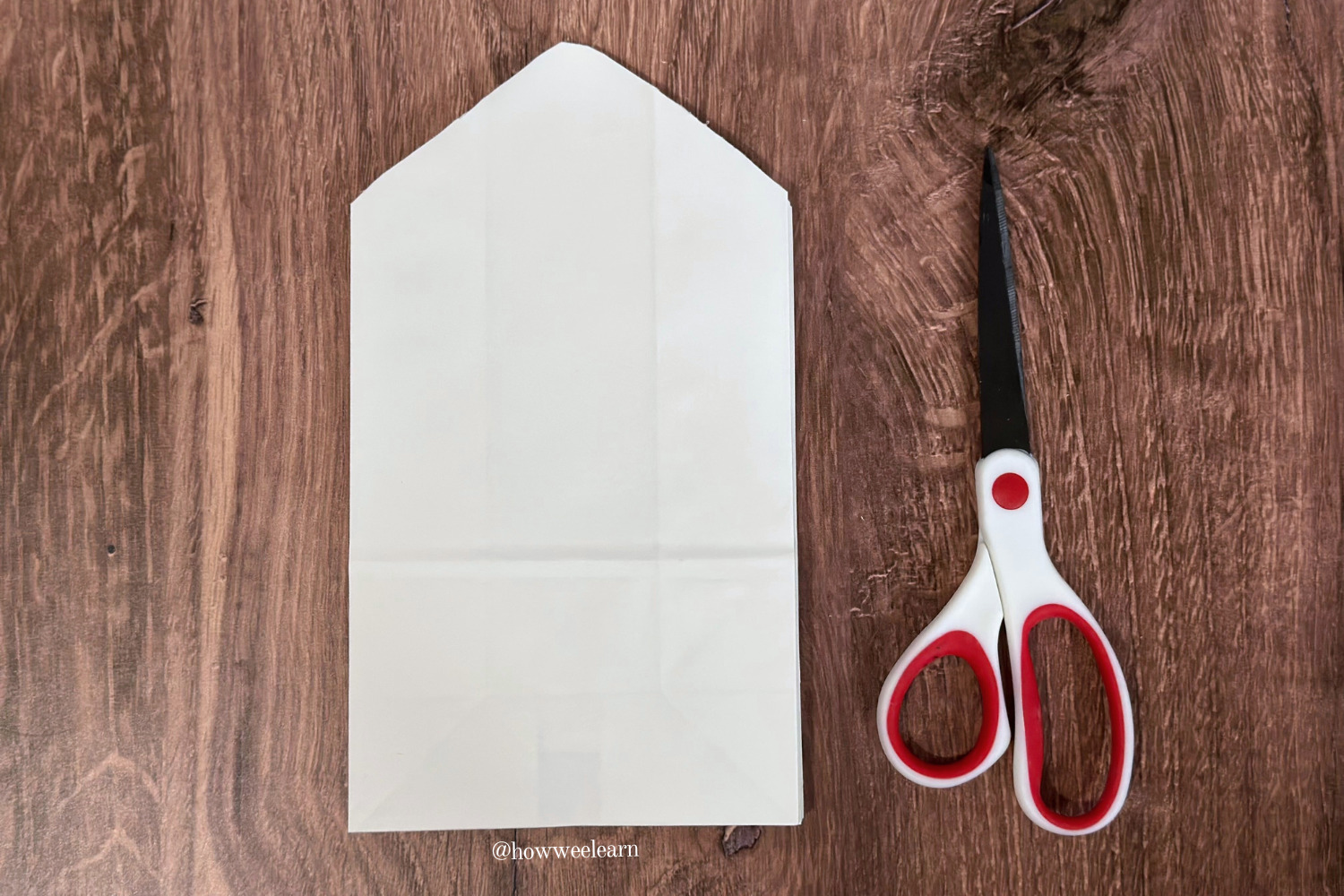 how to make a paper bag snowflake: cut the top into a point