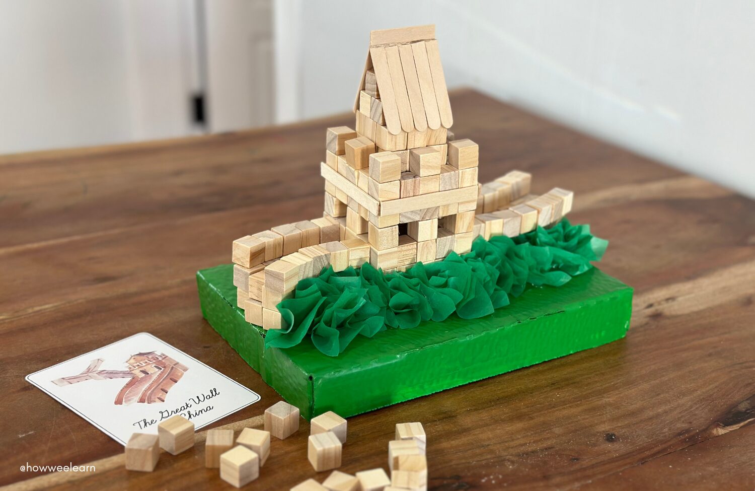 Building The Great Wall of China with small wooden blocks, architecture activity for kids