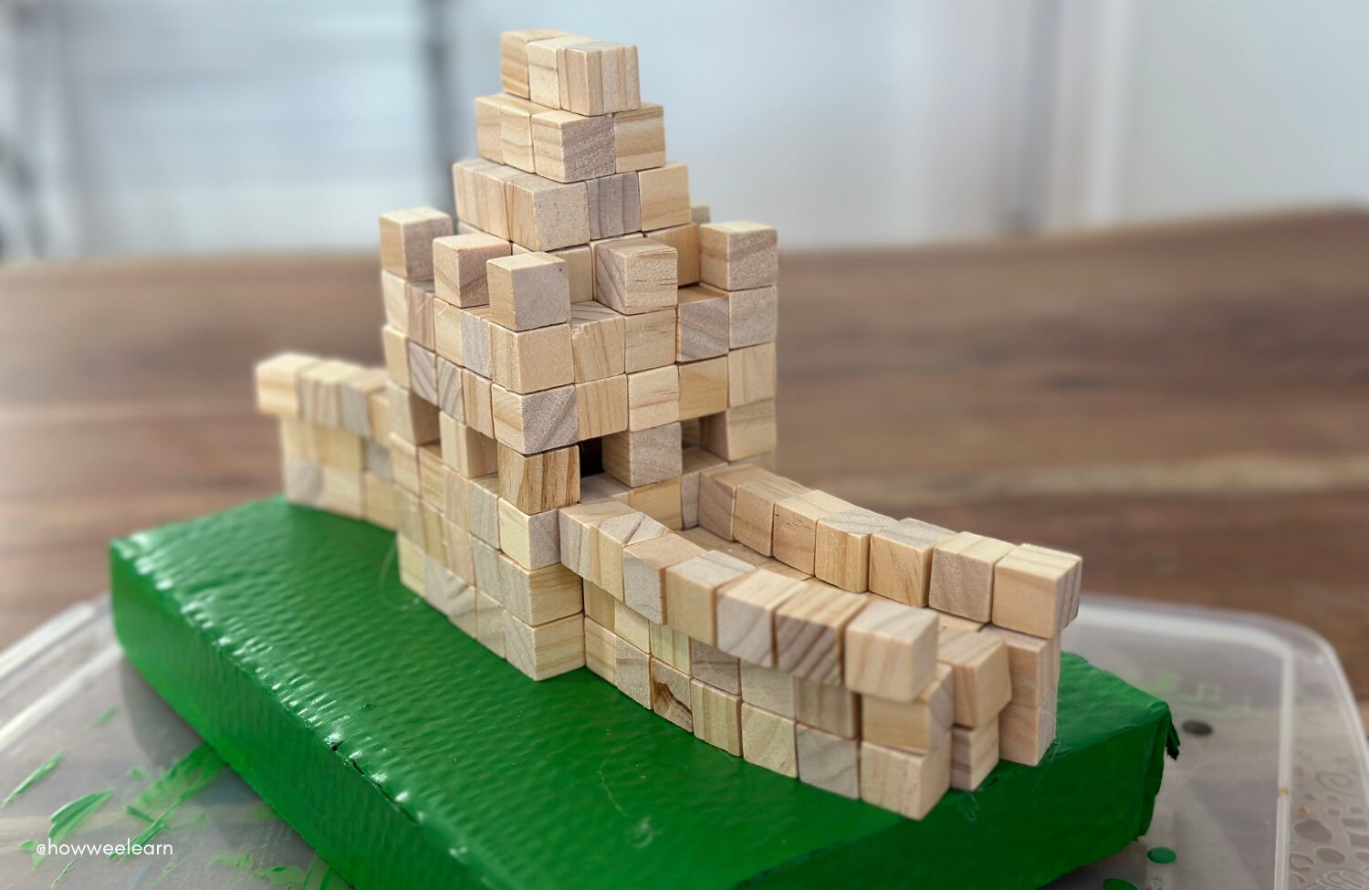Building The Great Wall of China with small wooden blocks, architecture activity for kids