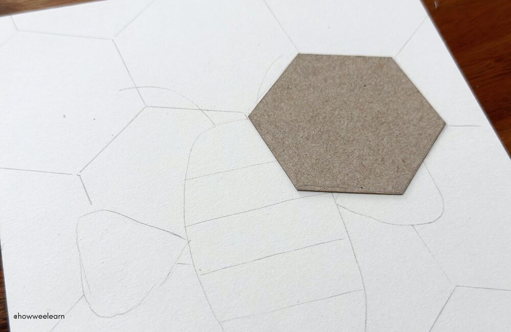 Tracing hexagon shapes in the background of a hand drawn bee picture