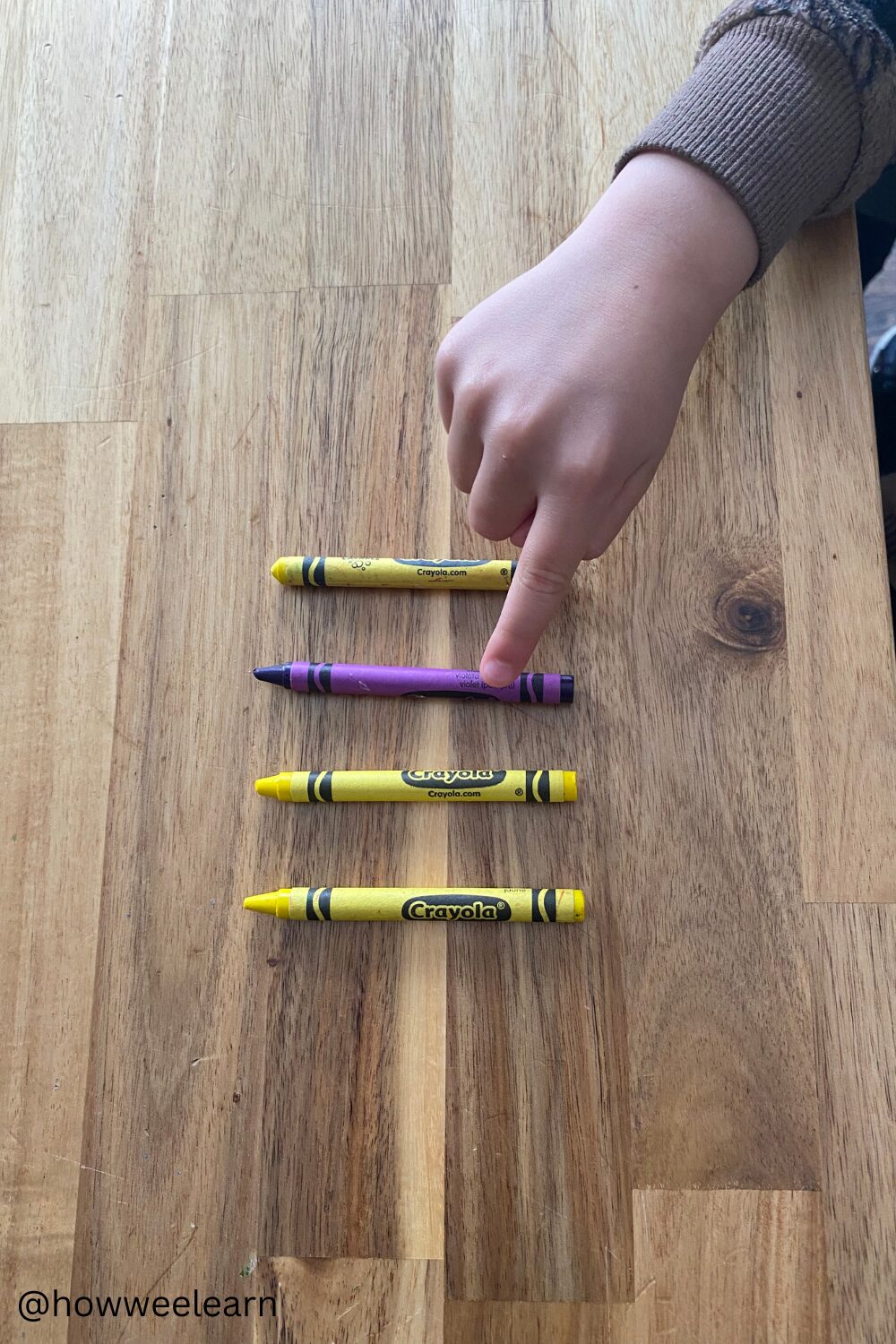 3 yellow crayons and one purple