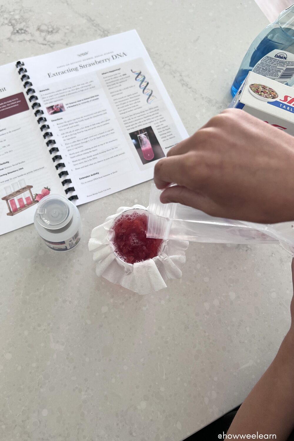 Strawberry mixture being filtered